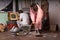 Woman in Robe Cleaning a Messy Room Using Vacuum