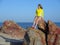 Woman on rocky beach