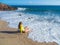 Woman on rocky beach