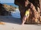 Woman on rocky beach