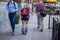 Woman rollerblade skates through Chicago Loop sidewalk during commuter rush hour