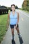 Woman with is rollerblade in summer time