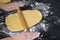 Woman rolling dough for homemade cookies. woman hands makes food