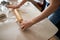 Woman rolling out pastry in the kitchen