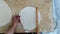 Woman rolls out dough, close-up. Making Turkish traditional bread top view