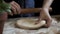 Woman rolls out yeast dough