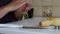 A woman rolls a wad of dough in her hands. Forms cookies. Close-up shot