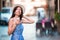 Woman in Rome with coffee to go on vacation travel. Smiling happy caucasian girl having fun laughing on Italian sidewalk