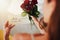 Woman, roses and note with gift in bedroom on birthday, celebration and valentines day event in home. Girl, reading