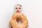 woman with round loaf of bread loaf model with transparent cloth on her head