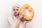 woman with round loaf of bread loaf model with transparent cloth on her head