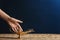 Woman rubbing magical Aladdin lamp on table