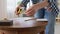 woman with ruler measuring table for renovation