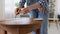 woman with ruler measuring table for renovation