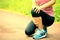 Woman runner holder her sports injured knee