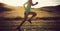 Woman runner running on grassland trail