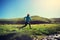 Woman runner running on grassland trail