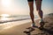 Woman runner seashore seaside tropical waves ocean island nature. Jogger legs sandy beach leisure time activity fitness