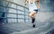 woman runner sportswoman running up city stairs