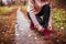 Woman runner ties her laces before a run