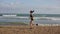 Woman running alone at beautiful sunset on the beach