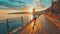 Woman running along a seaside promenade at sunset.