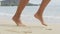Woman Running On Beach - feet closeup