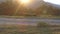 Woman running on a countryside road at sunset.