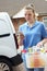 Woman Running Mobile Cleaning Business With Van Checking Text Me