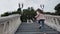 Woman is running over stone stairs of old building outdoors