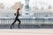 Woman running in the Retiro park in Madrid by a lake. Sport