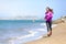 Woman running on San Francisco beach