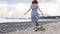 Woman runs along the beach at the sea shore