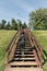 Woman runs up wooden stairs