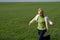 Woman rushing on green field