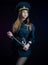 a woman in a Russian police uniform with a baton. English translation Police