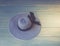 Woman`s accessories seen from above, top view. Concept image. Women`s hat on wooden