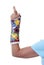 Woman\'s arm in painted cast