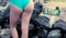 Woman\'s bikini backsine next to old wooden stop