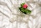 Woman`s bra on unmade bed.Openwork white cotton underpants on crumpled blanket. Red rose. Sexual underwear, gynecological health,