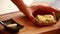 Woman\\\'s CloseUp Hands Preparing Avocado Toast with Boiled Egg