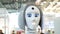 Woman`s face on a high-tech robot. Media. High-tech robot at the exhibition. Robotic of a human like droid robot