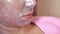 Woman`s face shot close-up. On her face is a cosmetic silver foil mask with colloidal silver. Care for problem skin