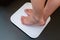 Woman`s feet standing on electronic scales for diet control