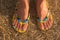 Woman`s feet wearing flip flops.