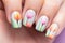 Woman\\\'s fingernails with colorful tulip spring flower nail art design