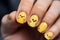 Woman\\\'s fingernails with seasonal Easter nail art design with cute yellow Easter chicks