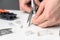 A woman\'s hand cuts the ends of the wire for a utp ethernet network cable plug. Internet communications concept