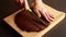 Woman\\\'s Hand Cutting Chocolate Brownie Fudge CloseUp