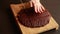 Woman\\\'s Hand Cutting Chocolate Brownie Fudge CloseUp